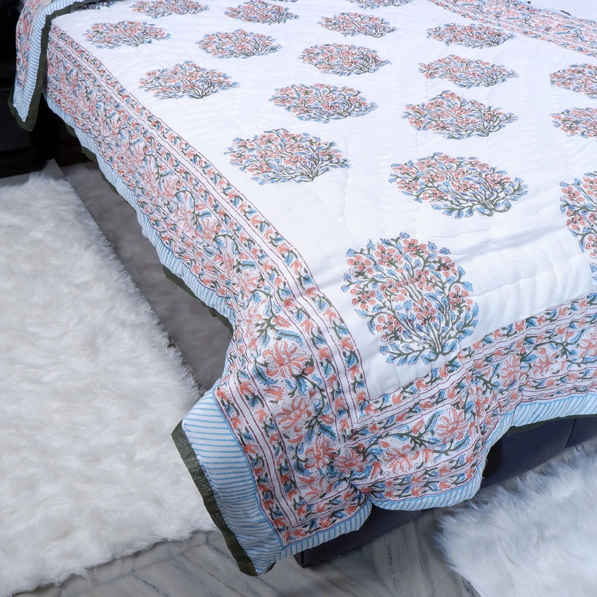 Jaipuri cotton quilt single bed featuring vibrant floral patterns and intricate borders